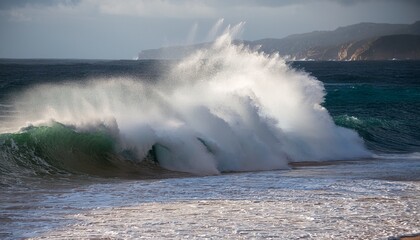 large powerful wave crashing against the shoreline of a beach