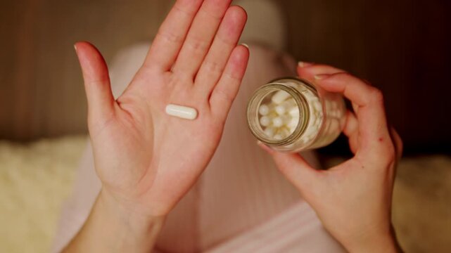 Pills and vitamins macro, Close up view of womans hands holding plenty of different drugs. Painkillers and antibiotics. Healthcare and medicine concept