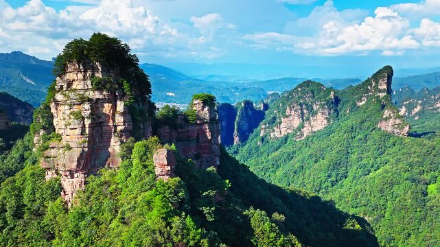 Aerial view of magnificent quartz sandstone pillars and lush green forest in Zhangjiajie National Forest Park, the inspiration for Avatar mountains, Hunan, China.