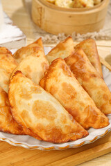 Crispy Fried Dumplings with Vermicelli and Leek Filling - Traditional Asian Noodle Dish