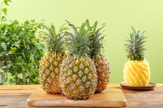 Fresh Zhanjiang Pineapples from Guangdong China on Wooden Cutting Board - Sweet Tropical Fruit