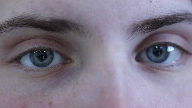 Macro view of young woman with beautiful eyes