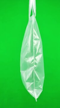Transparent Material Study with plastic bag rotating on green screen background distortion, overlay, glitch, static noise, scan lines black background, 4k animated video loop
