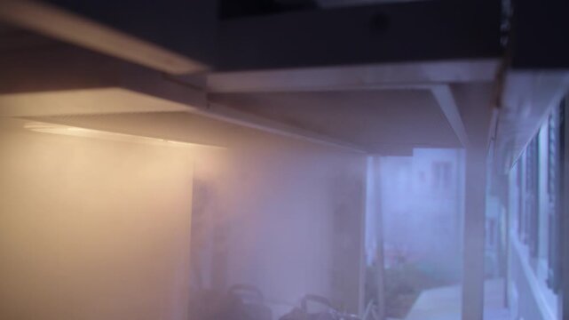 Modern Kitchen Extractor Hood Clearing Rising Steam Above Stove in Contemporary Apartment Interior Showing Ventilation System and Everyday Cooking Routine