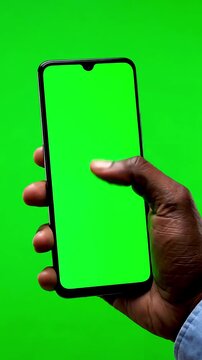 Green Screen man s hand holding a black smartphone with and touching or press display using mobile phone chroma key touch on background scene 4 distortion, overlay, glitch, static noise, scan lines