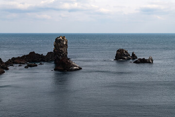 idyllic seascape with rocks on the sea at Seopjikoji in Jeju Island, South Korea