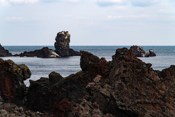 idyllic seascape at the seaside of Seopjikoji in Jeju Island, South Korea, on overcast day