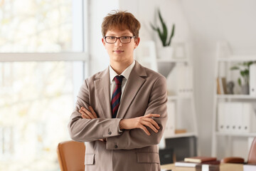 Fototapeta premium Portrait of young redhead businessman in office