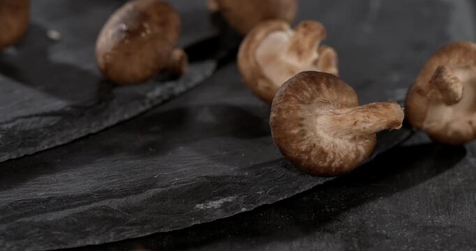 Super slow motion, Slowmotion Shot Of Shiitake Mushrooms Arranged On Slate
