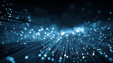 A stunning visual representation of fiber optic cables with glowing blue light particles radiating from the center