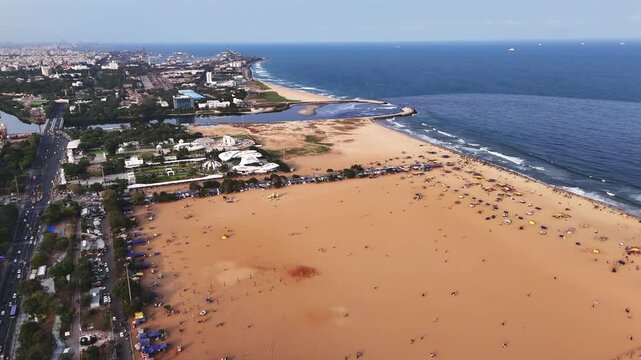 Aerial perspective of the MGR Memorial Arch &mdash; set against Marina&rsquo;s vast shoreline, where city roads, greenery, and ocean waves converge.**