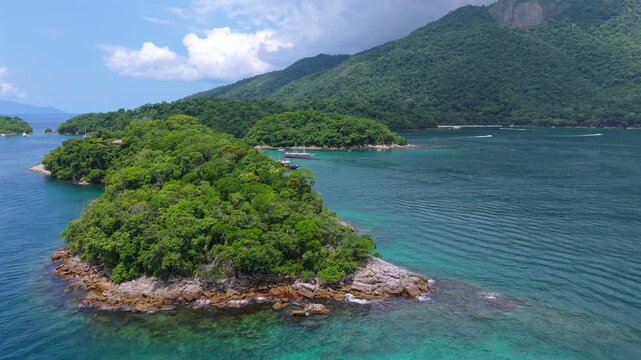 Lagoa Azul lagoon area on Ilha Grande featuring transparent tropical waters, rocky shoreline and Atlantic Forest vegetation inside Ba&iacute;a da Ilha Grande Angra dos Reis Rio de Janeiro Brazil, aerial shot