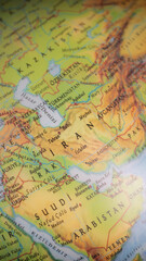 Fototapeta premium World map with focus on Iran. The United States and Iran are on the brink of war. Political tension or crisis. Part of the world map. Middle Eastern countries are in focus. Selective focus. 