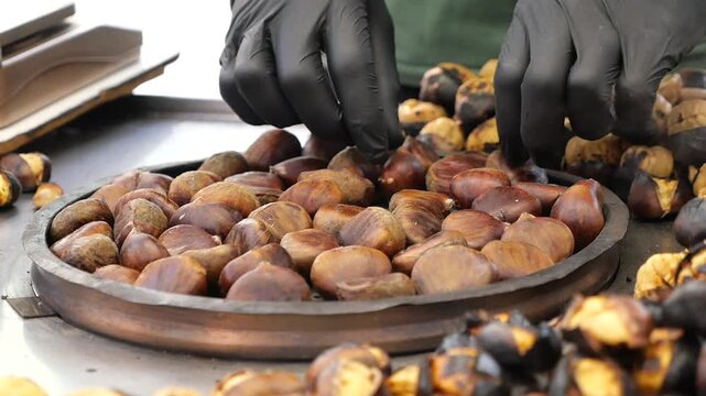 Chestnuts being roasted on a street in autumn
