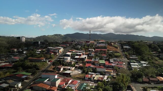 Aerial of highland town San Ramon Costa Rica in dry season with blue sky