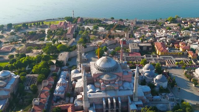 Istanbul, Turkey. Drone panorama of historic Fatih district with Hagia Sophia mosque and sea at sunrise. Aerial View, MasterShots, Spiral forward