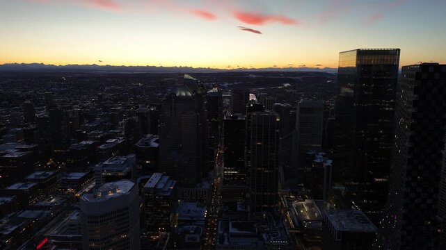 Aerial view of downtown Calgary cityscape by drone on a beautiful winter evening. 