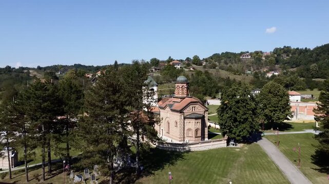 Aerial view of Church of Saint Basil of Ostrog near Valjevo, Serbia, surrounded by rural landscape. g.