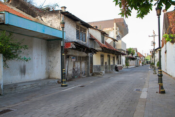 Fototapeta premium Quiet Historic Alley with Old Colonial Buildings in Kota Lama Semarang Indonesia