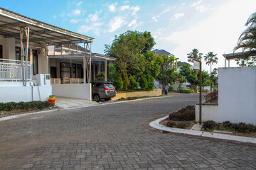 Naklejka premium Quiet Residential Street with Modern Houses in Semarang Indonesia