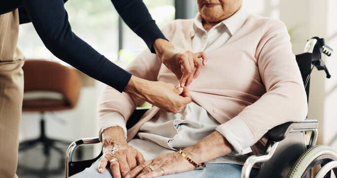 Help, hands and nurse dressing old woman in wheelchair for hygiene, personal care or support. Clothes, senior person with disability and carer with buttons for assisted living, assistance or service
