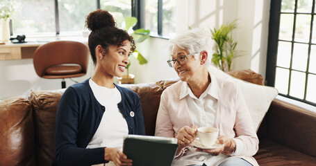 Old woman, nurse and tablet on couch with laugh for streaming, video or article in living room....