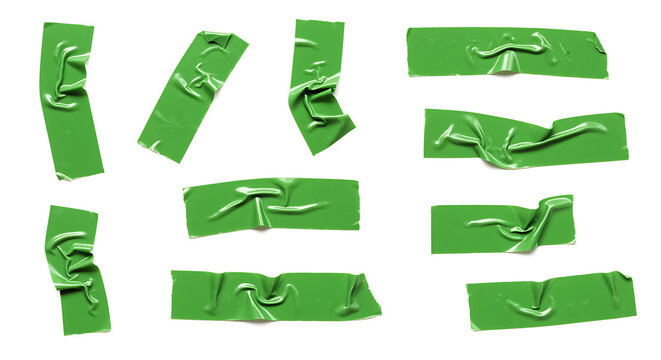 Collection of torn green paper strips on a white background.