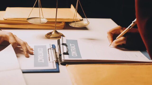 Justice and law concept. Gavel on sounding block in hand's Male judge at a courtroom, working with document law books, report the case on table in modern office.