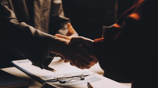 Justice and law concept. Gavel on sounding block in hand's Male judge at a courtroom, working with document law books, report the case on table in modern office.