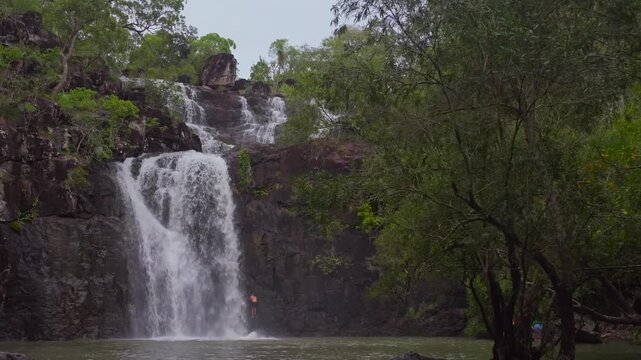 Cedar Creek WaterfallAustralia Falls Conway Forest Reserve National Park Whitsunday island region blue sky cloudy tropical forest rainy season freshwater swimming Proserpine Airlie Queensland pan left