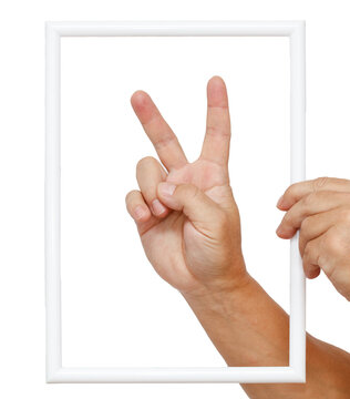 A hand holding a white frame with a hand in the middle of it