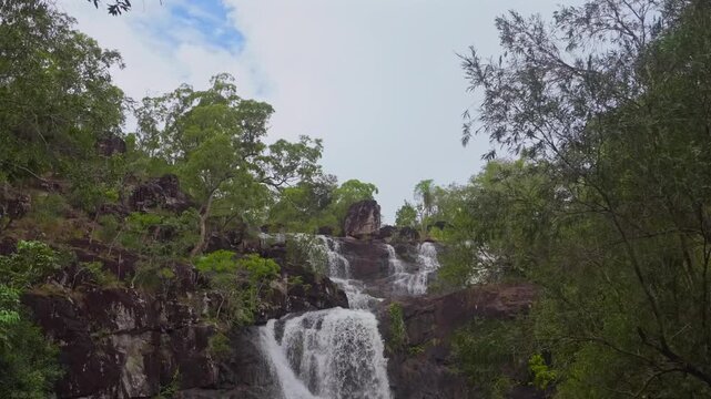 Cedar Creek Waterfall Australia Falls Conway Forest Reserve National Park Whitsunday island region Proserpine Airlie Queensland tropical jungle forest rainy season freshwater blue sky cloudy pan down