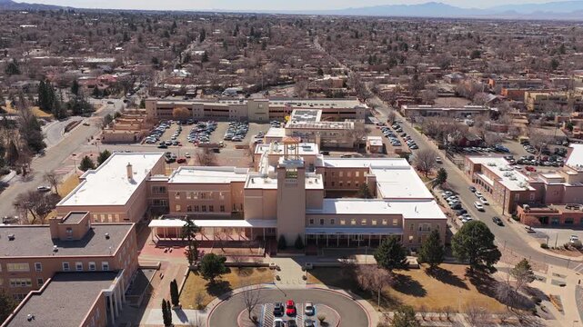 Fly forward toward the main administrative building for the State of New Mexico. This 4K perspective highlights the heart of the Santa Fe government district.