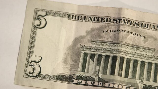 Five US Dollar Bill. Close up of USA, American currency. Back side of the 5 $ dollar bill