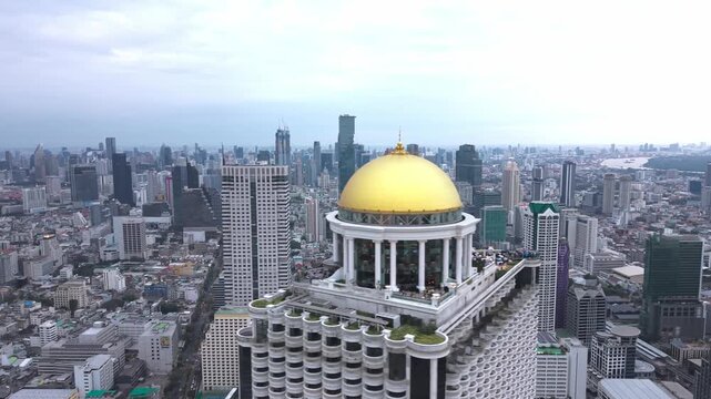 Aerial view of State Tower rising above Bangkok&rsquo;s skyline, its golden dome and neoclassical design standing out over the Chao Phraya River district. (5)