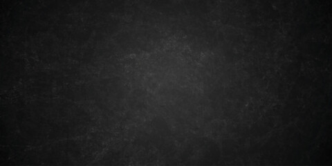 Dark charcoal grunge wall texture background. Dark black rough grunge surface with smoke edge. Black texture chalk board and black board. © MDFAIMIDULISLAM