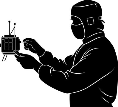 Cleanroom technician assembling miniature satellite components