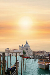 Fototapeta premium Basilica Santa Maria della Salute and gondola in Venice at sunset