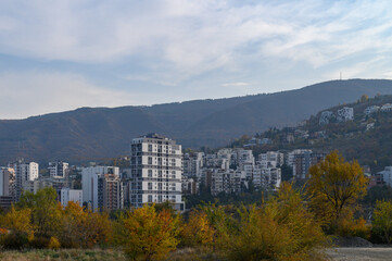 Panoramic Landscape Shot of Tbilisi, Georgia. View of the City, Kura River (Mtkvari), and Surrounding Mountains. © Михаил Шорохов
