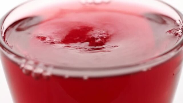 Indian sugar syrup sharbat beverage close-up macro shot with glossy droplets slow rotation refreshing drink