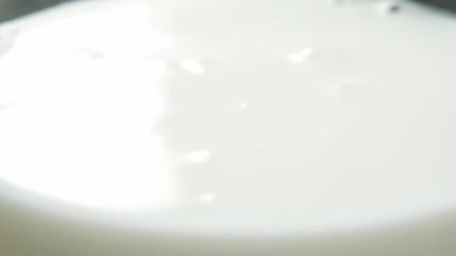 Professional close-up of ayran drink surface detail slow rotation camera smooth texture emphasis