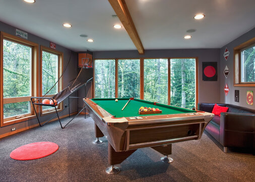Interior view of a family games room with a pool table.