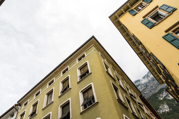 Fototapeta premium Buildings in Riva del Garda with shutters and cloudy sky