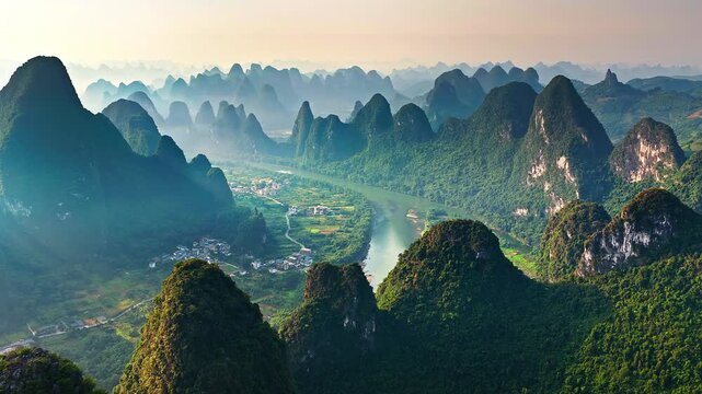 Aerial view of the majestic karst mountains and the Li River flowing through the valley in Yangshuo, Guilin, China.