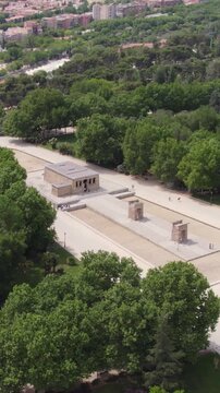 Ancient Temple of Debod with scenic surroundings in Madrid. Vertical aerial