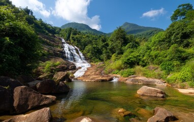 Serene Vietnamese Waterfall Amidst Lush Green Mountains from a Lower Angle