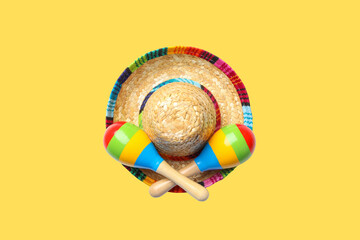 Fototapeta premium Cinco de Mayo, Colorful maracas and a sombrero ready for celebration