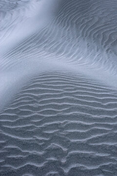 Textured sand patterns at Wharariki Beach New Zealand