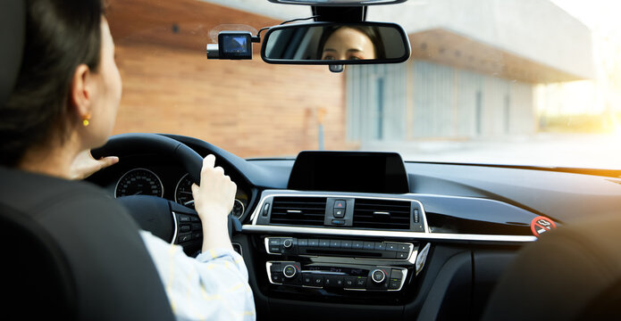Asian girl driving a car