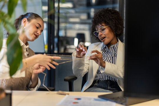Colleagues collaborating and connecting with teamwork in a modern office